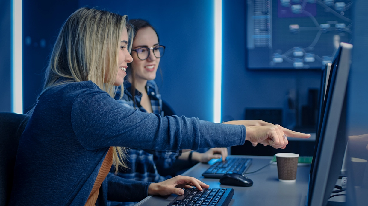 Two techs looking at a computer