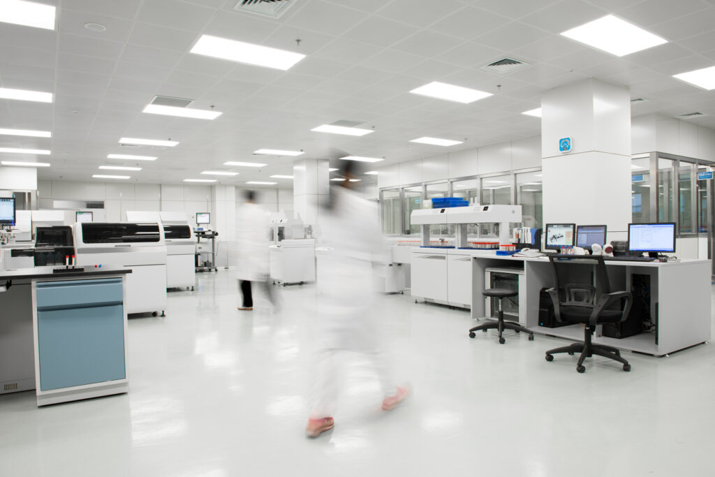 Blurred motion of scientists walking in an optical laboratory